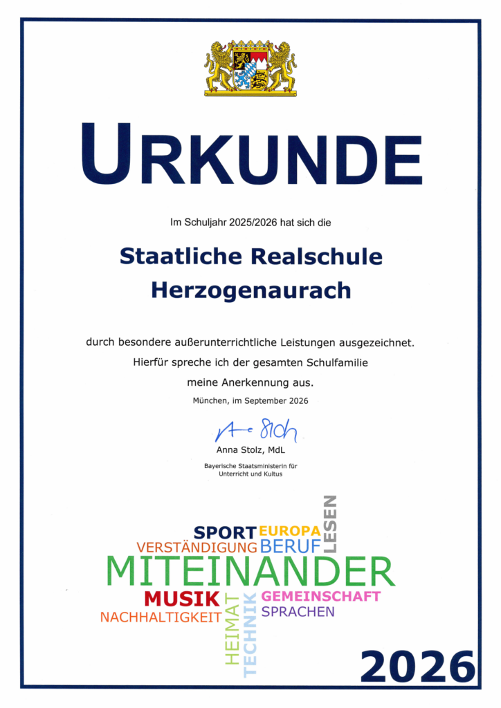 Urkunde des Bayerischen Kultusministeriums für besondere außerunterrichtliche Leistungen der Realschule Herzogenaurach im Schuljahr 2025/2026